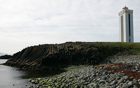 columnar basalt cliffs and lighthouse at Kálfshamarsvík, Kálfshamarsnes